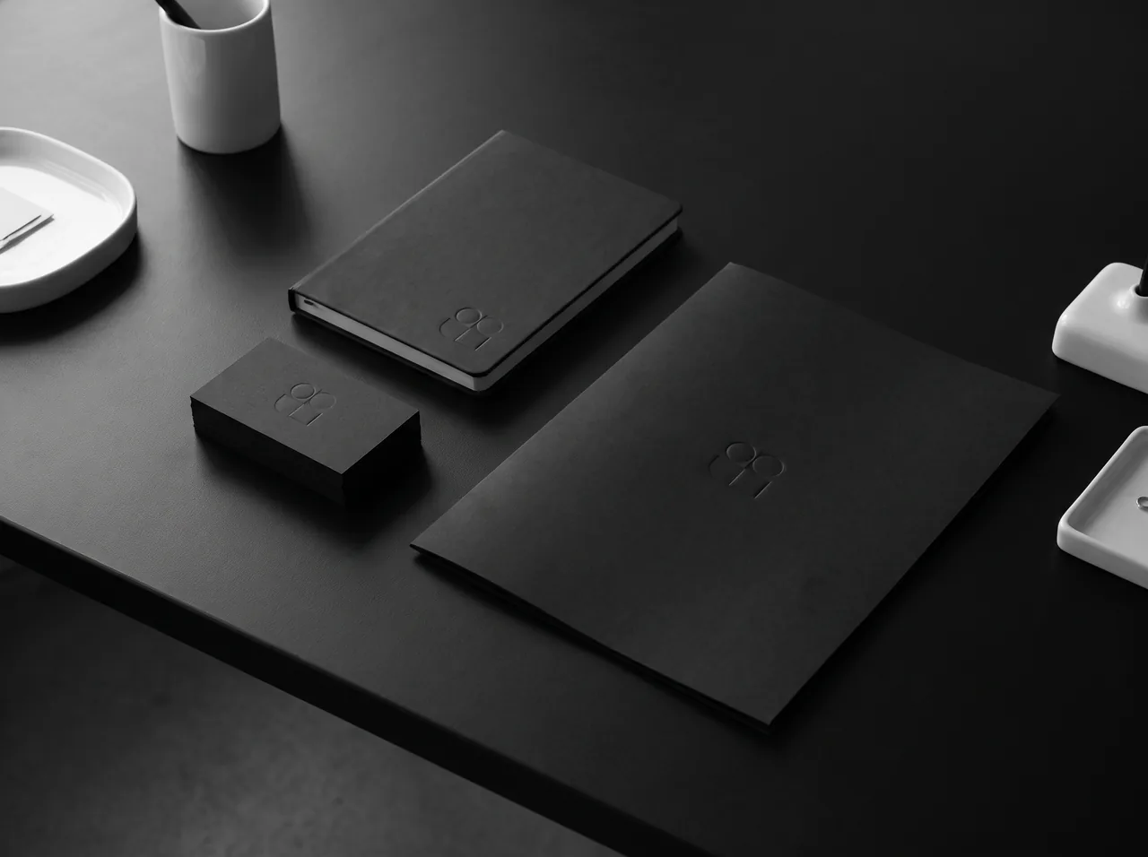 Black stationery set with an embossed geometric mark